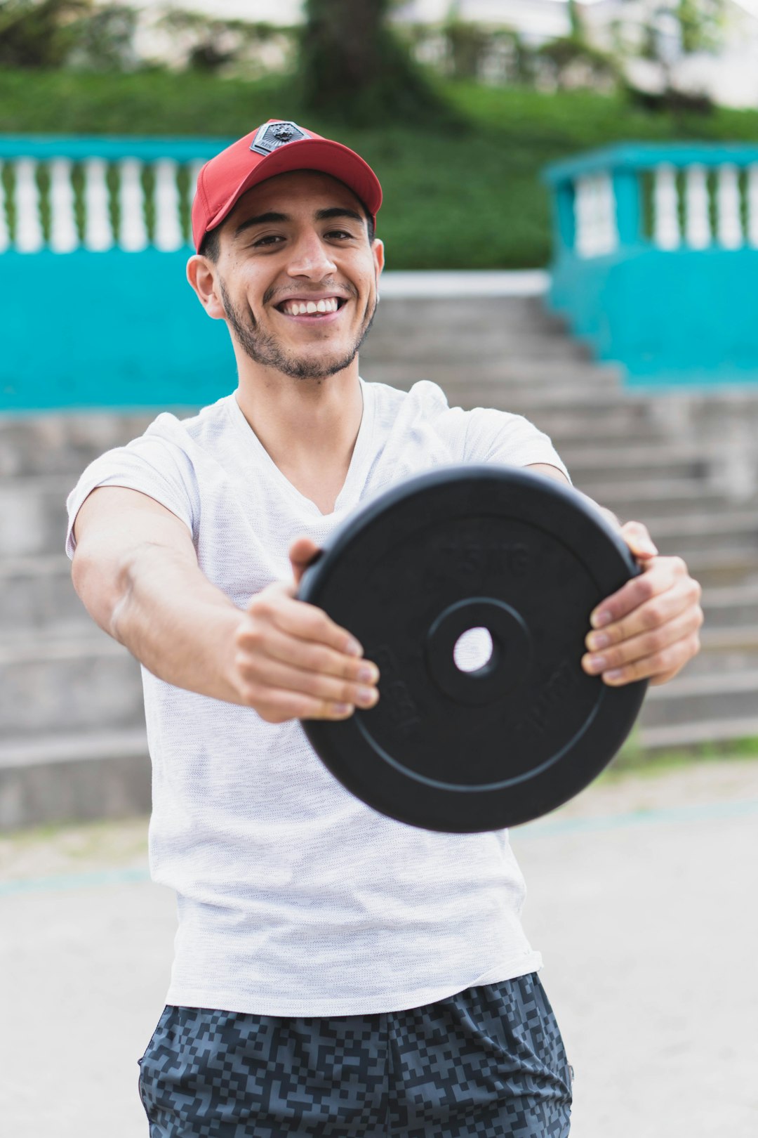 Young man doing different types of exercises in the park.
